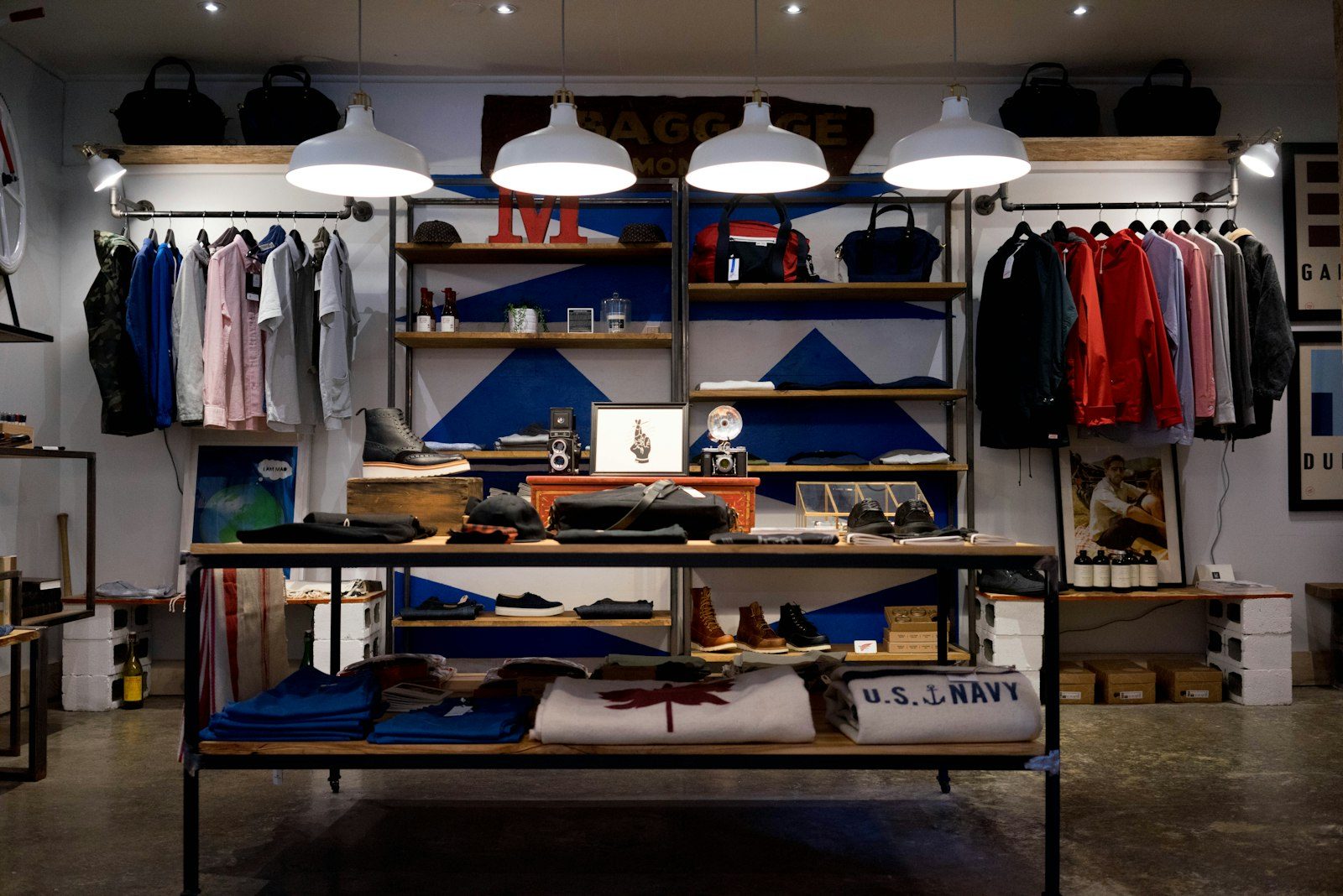 Interior of a modern high-end fashion retail storefront and apparel displays