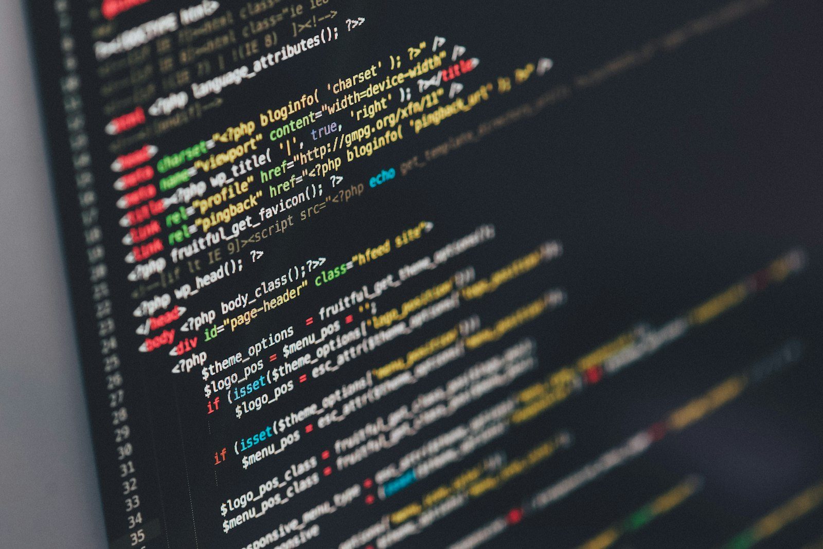 Computer monitor displaying complex terminal code routines and multi-task development workflows