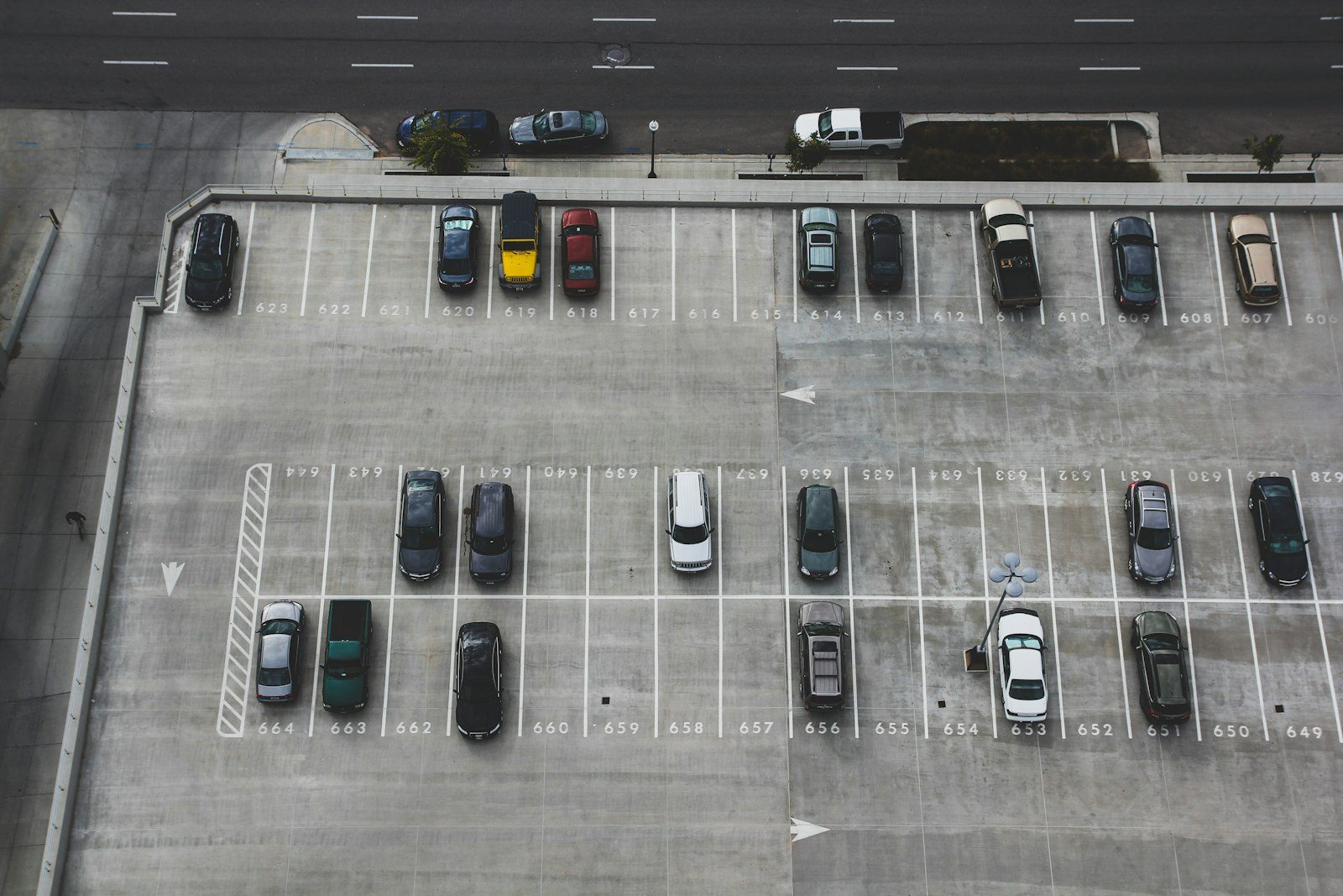 A perspective view of a multi-lane metropolitan transit highway with overhead sensor gantries and traffic monitoring infrastructure.