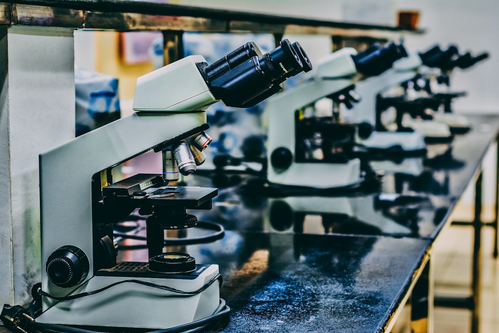 A modern biochemical research laboratory with automated diagnostic pipettes and reagent arrays for protein synthesis.