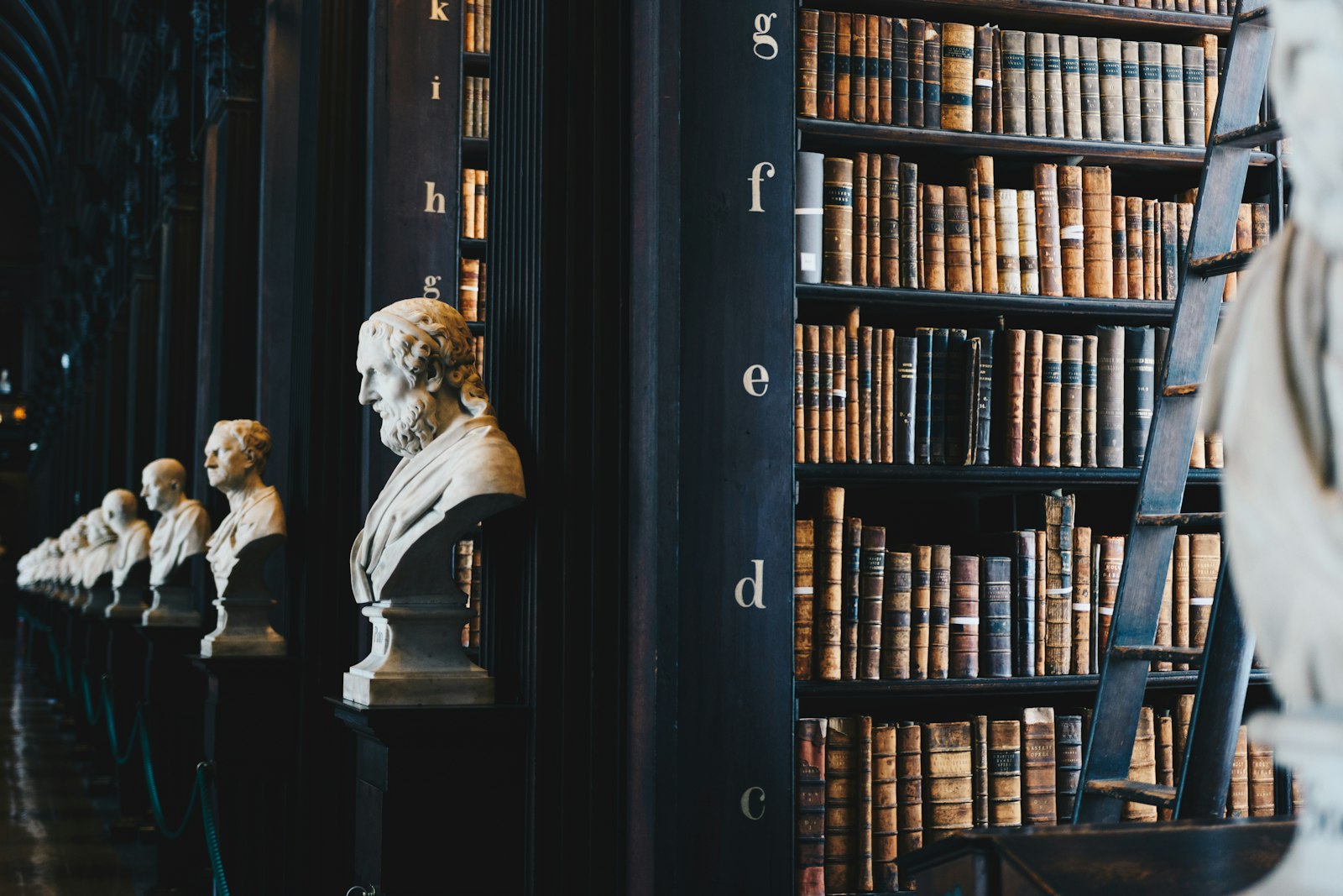 Classical legal columns and federal antitrust documentation representing executive accountability and market regulation